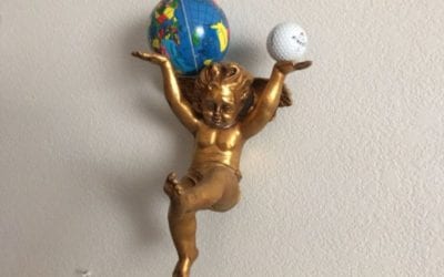 Holding up the World Angels, golf balls and the World
