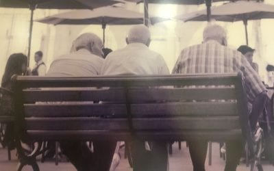 Three Old Men Sitting on a Bench